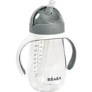 Beaba Straw Sippy Cup in charcoal with a clear body, measuring scale, and ergonomic handles.
