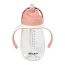 Straw sippy cup in rose color with transparent body, measuring marks, and dual handles for easy grip.