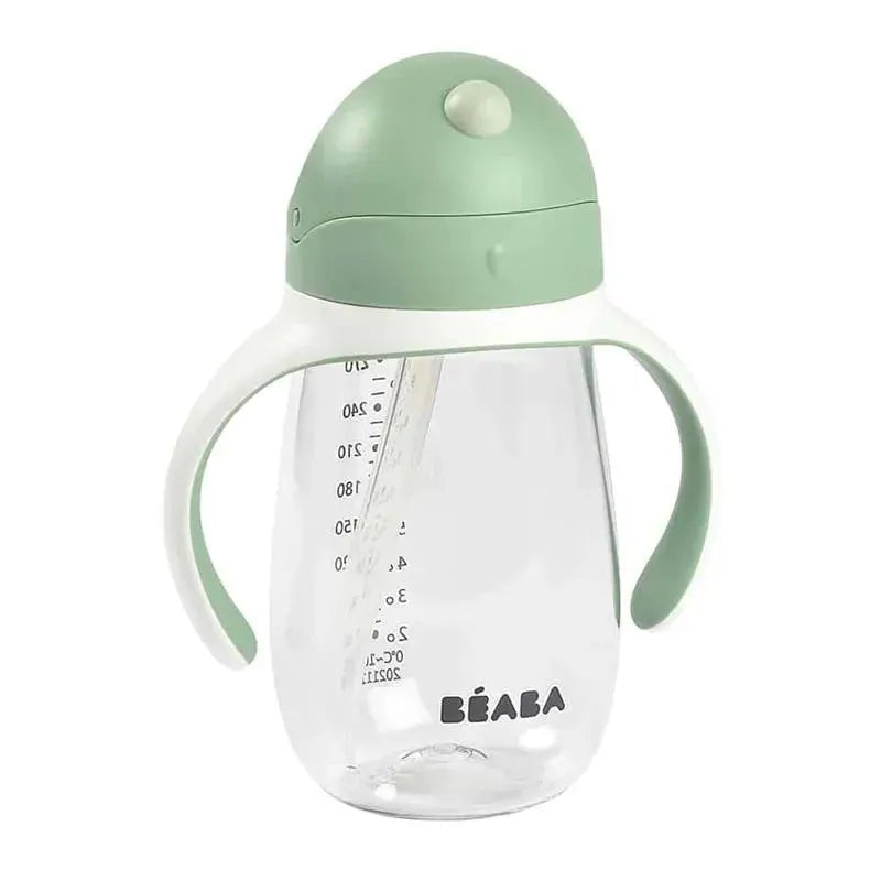 Beaba Straw Sippy Cup in sage color features a transparent body with measurement markings and two easy-to-grip handles.