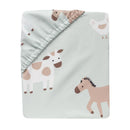 Bedding set featuring a light green design with playful animal illustrations, including cows, horses, and a chicken.