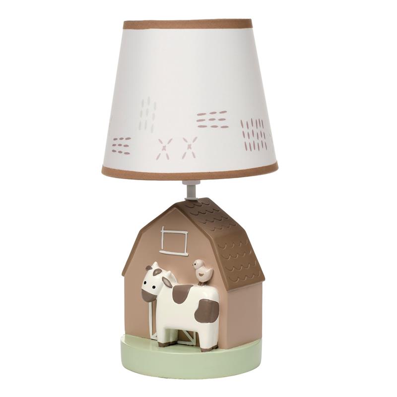 Decorative nursery lamp featuring a cow and bird design, with a house-shaped base and a patterned lampshade.