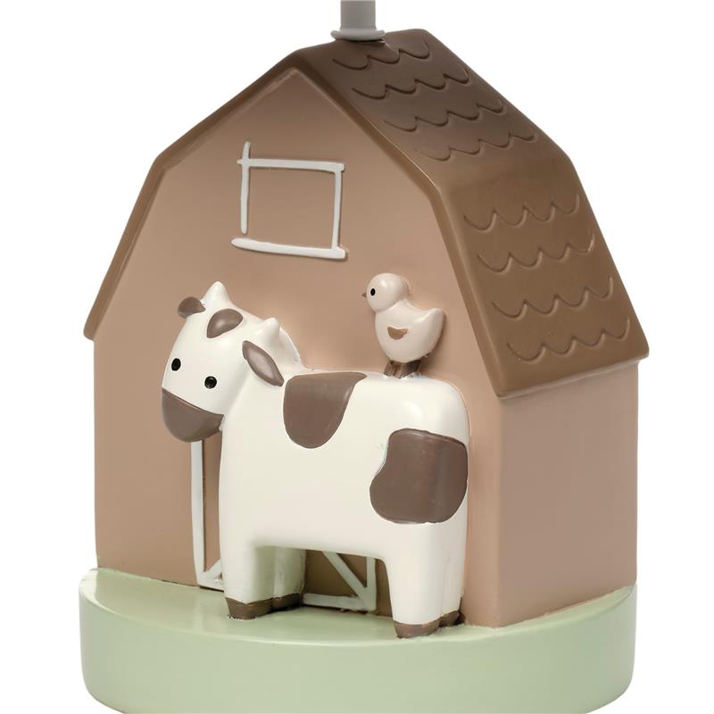 Decorative nursery lamp featuring a cow and a bird on a barn-shaped base, perfect for bedtime ambiance.