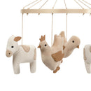 Farmyard-themed musical baby crib mobile featuring plush cow and chicken toys, designed to soothe infants.