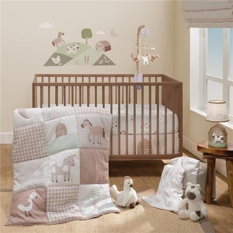 Musical baby crib mobile soother toy with farm-themed plush animals, a quilt, and nursery decor featuring animals and a barn.