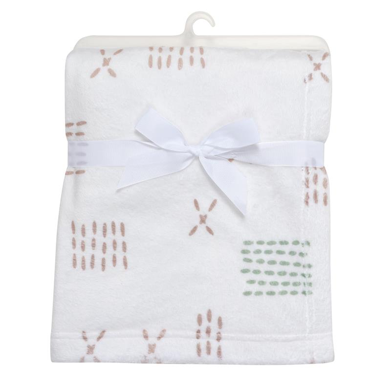 Soft white fleece baby blanket from Bedtime Originals, featuring an assortment of pastel patterns and a white ribbon tie.