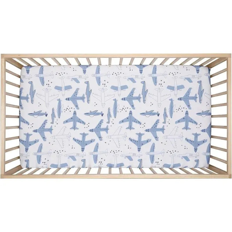 Crib sheet featuring a playful airplane pattern in blue tones, designed for infants.