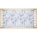 Crib sheet featuring a playful airplane pattern in blue tones, designed for infants.
