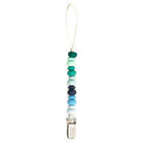 Bella Tunno Boy Multi Pacifier Clip with a variety of textured beads in blue and green hues, featuring a secure clip.