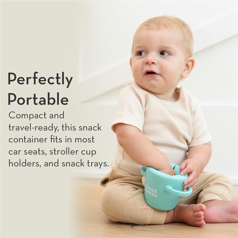 Bella Tunno silicone snack cup for toddlers, highlighted as portable and spill-proof, held by a child.