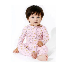 Bamboo footie for infants in pink with milk and cookies pattern, featuring a front zipper and a seated baby model.