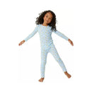 Blue two-piece pajama set featuring a child with curly hair, smiling while posing playfully, adorned with milk and cookies patterns.