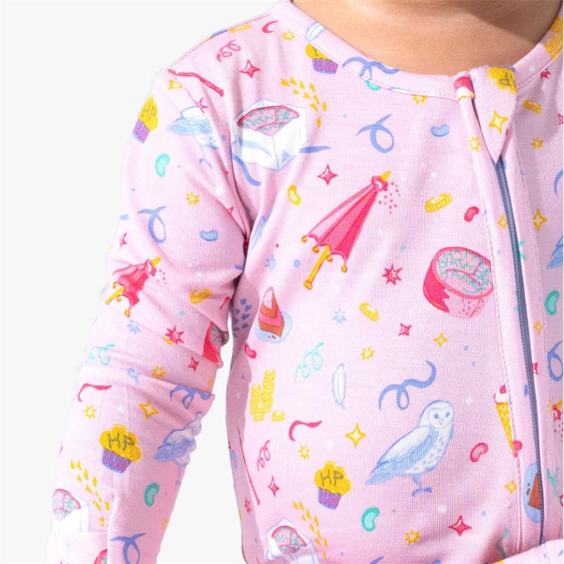 Bamboo footie in pink with colorful Harry Potter-themed graphics, including cupcakes, owls, and wands.