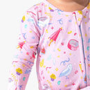 Bamboo footie in pink with colorful Harry Potter-themed graphics, including cupcakes, owls, and wands.