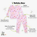 Bamboo kids pajamas from Bellabu Bear featuring a pink top and pants with colorful prints and text highlighting comfort and safety features.