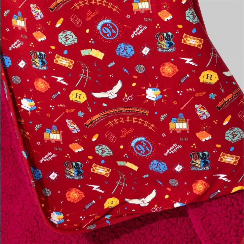 Hogwarts Express bamboo blanket featuring red fabric with iconic Harry Potter motifs like the train, 9¾ platform, and magical items.