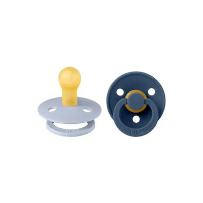 Natural rubber baby pacifiers in dusty blue and steel blue colors, designed for infants 6 to 18 months.