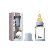 Baby blue Bibs 4oz latex glass bottle with a yellow nipple and a matching silicone bumper, packaged in a box.