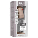 4oz Bibs baby bottle featuring a blush silicone lid and clear glass body; designed for easy breast-to-bottle transition.