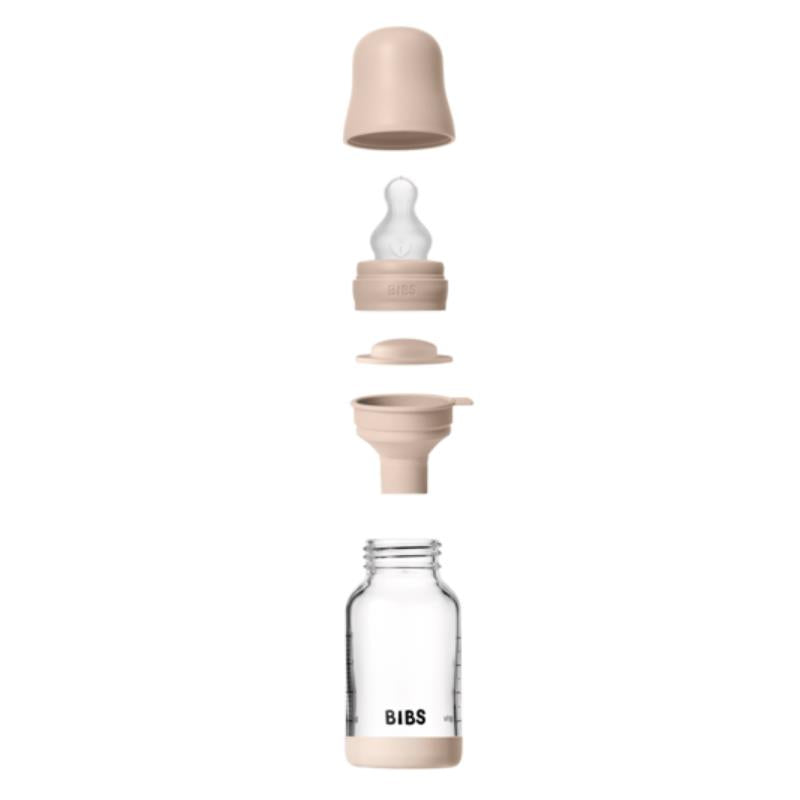 4Oz silicone baby bottle by Bibs, featuring a blush bumper, cap, and nipple, showcasing its layered components.
