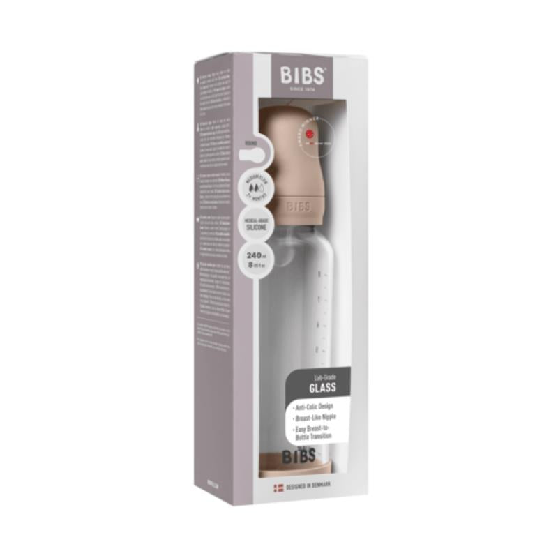 Baby 8oz silicone glass bottle with blush-colored silicone lid, featuring anti-colic design and measurements on the side.
