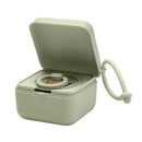 BIBS pacifier box in sage color, showcasing an open design with a pacifier inside and an attached loop for easy carrying.