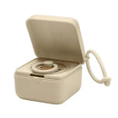 Bibs pacifier box in vanilla color, open to display a pacifier inside, with a side attachment loop.