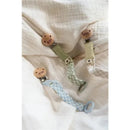 Three Bibs pacifier clips in Dark Oak and Vanilla colors, featuring wooden clips and fabric straps with various patterns.
