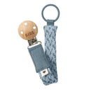 Bibs pacifier clip in petrol and baby blue, featuring a wooden clip and textured fabric strap.