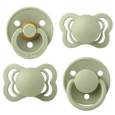Natural rubber and silicone pacifiers in sage green, featuring various designs, suitable for ages 0-6 months.