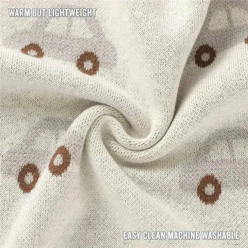 Luxury cotton baby blanket in cream featuring car and donut patterns, highlighting warmth, lightweight, and machine washable care.