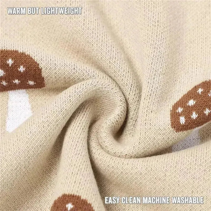 100% luxury cotton baby blanket in mushroom camel color, featuring mushroom patterns, warm yet lightweight, machine washable.