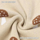 100% luxury cotton baby blanket in mushroom camel color, featuring mushroom patterns, warm yet lightweight, machine washable.