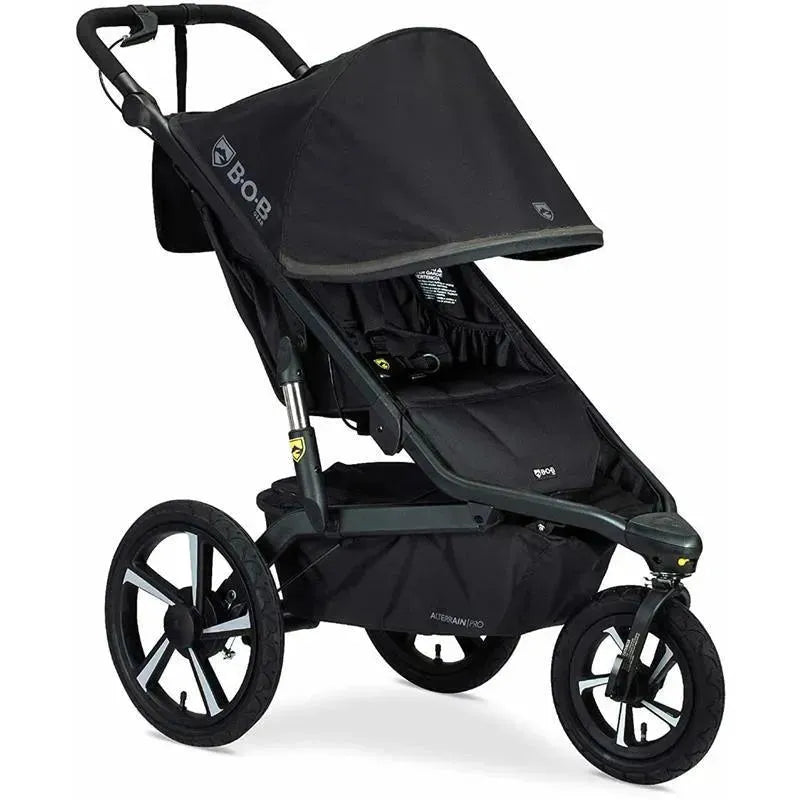 Britax BOB Gear Alterrain Pro All-Weather Jogging Stroller in black, featuring large wheels, a protective canopy, and a spacious seating area.