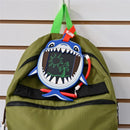 Boogie Board Sketch Pals Ocean Friends - Clark Shark drawing tablet attached to a green backpack, displaying a sun and palm tree sketch.
