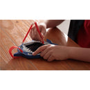 Child using a red stylus to draw on a Boogie Board Sketch Pals tablet shaped like a shark.