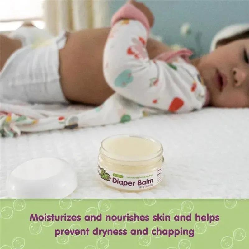 Baby diaper rash balm jar with a lid, featuring text on moisturizing benefits, beside a child lying on a bed.