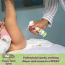 A hand sprays Boogie Wipes diaper rash spray on a baby’s bottom while the child’s legs are elevated, with wipes visible underneath.