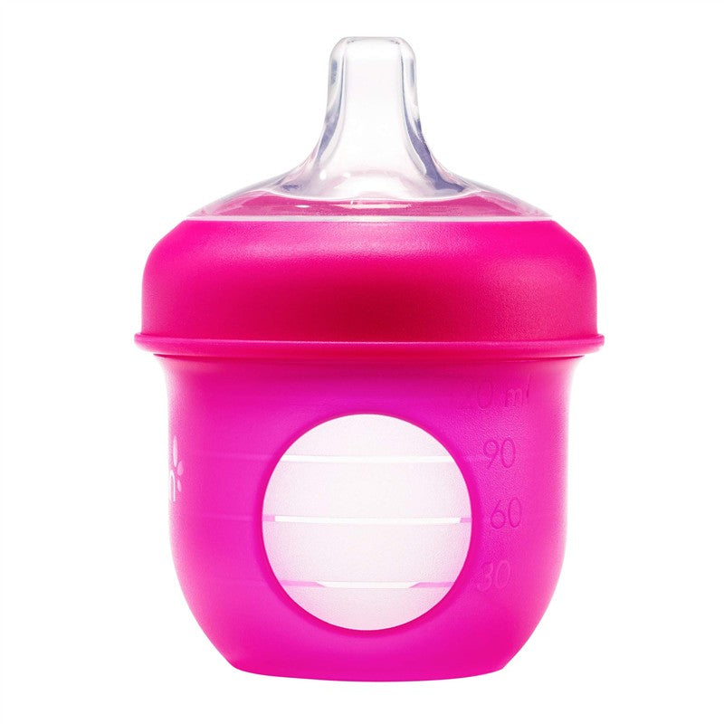 Boon NURSH Silicone Sippy Spouts in vibrant pink, featuring a clear spout and measuring marks on the side.