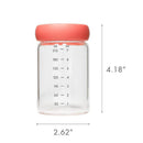 Glass milk storage jar with a pink lid, measuring 4.18 inches tall and 2.62 inches wide, marked with volume measurements.
