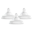 Three white silicone bottle nipples designed for preemie flow, featuring a curved shape for easy feeding.