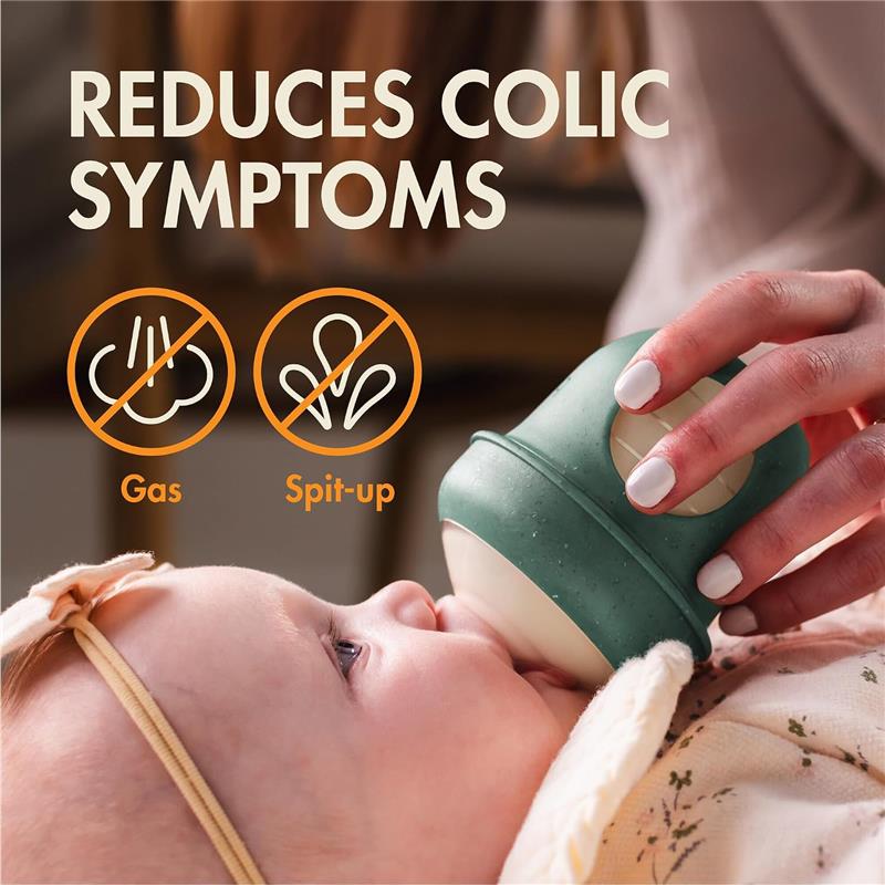 Boon 4 Oz Nursh silicone baby bottle in green speckle, reducing colic symptoms, with graphics indicating it helps with gas and spit-up.