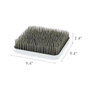 Boon - GRASS countertop drying rack in grey, featuring a textured surface with upright prongs for drying dishes.
