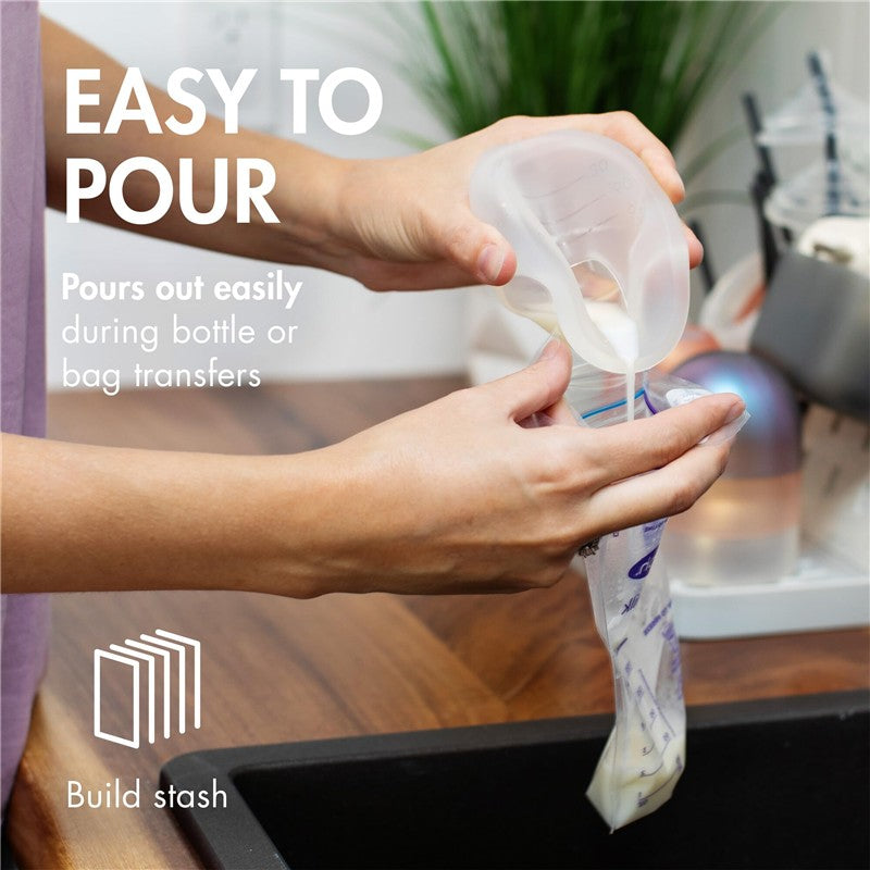 Silicone breast milk collection cup pouring milk into a storage bag, featuring clear measurement markings for easy use.
