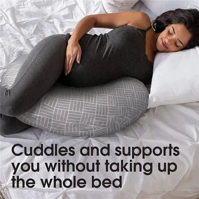 Cuddle pregnancy pillow in gray basket weave, supporting a pregnant woman resting comfortably in bed.