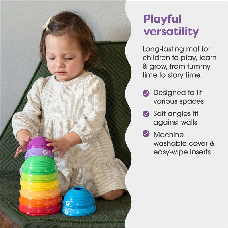 Boppy Foam Play Mat for children, featuring a child stacking colorful cups, designed for versatile play and easy cleaning.