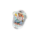 Infant sitting happily in the Bright Starts Whimsical Wild Cradling Bouncer, holding a toy with colorful animal designs.