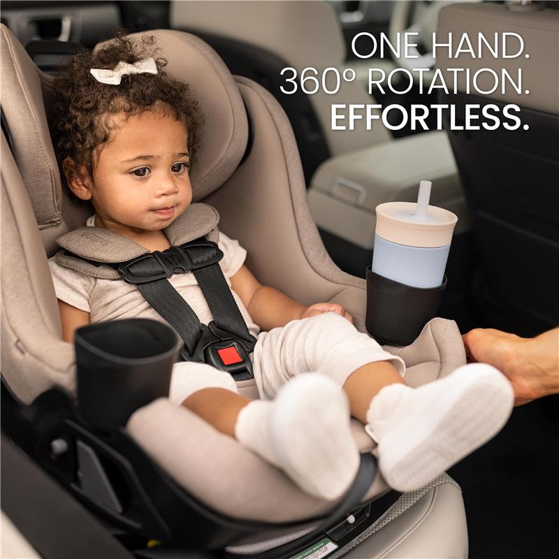 Britax Galaxy360 Slim Rotating Convertible Car Seat in Teak, featuring a child securely strapped in and a cup holder with a drink.