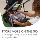 Lightweight Britax Grove Modular Stroller with extra large cargo basket and five storage pockets; woman accessing storage.