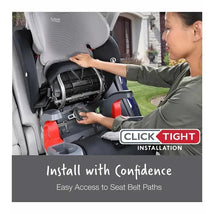 Britax Grow With You ClickTight Harness Booster Car Seat in grey; a user demonstrates installation with easy access to seat belt paths.