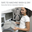 Britax One4Life Slim All-in-One Car Seat in Sea Foam, with removable parts being held by a woman near a washing machine.